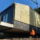 Six net-zero council houses for homeless people have been lifted into place in Woodseats
