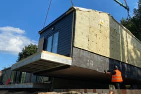 Six net-zero council houses for homeless people have been lifted into place in Woodseats