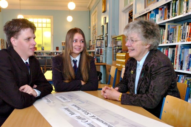 Anne Miller (right) of Macmillan Cancer Support talking to Sunderland High School prefects Chris Dixon (left) and Abbey Powell after they presented a  cheque for £1060 from the school's coffee morning 16 years ago.