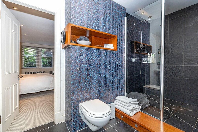  En suite shower room which links with bedroom three/dressing room.