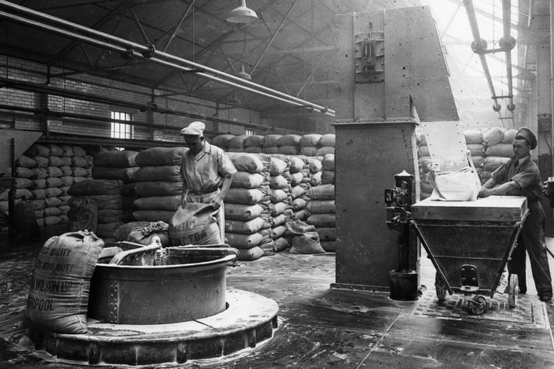 1926: Employees at work in one of the flour blending plants,