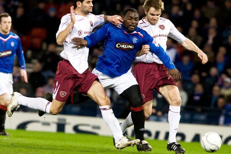 Goals from Barry Ferguson and Jean-Claude Darcheville saw Rangers beat Hearts in the League Cup semi-final.
