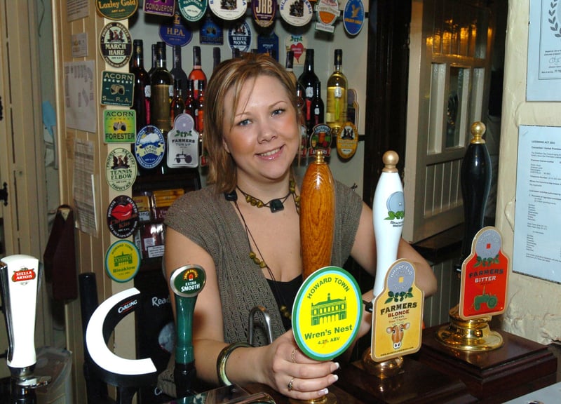 Pictured behind the bar at the Robin Hood pub, on Greaves Lane, Stannington, Sheffield, in 2006 is the landlady Keeley Ayres