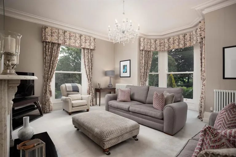 The drawing room gets lots of natural light with its large bay window.