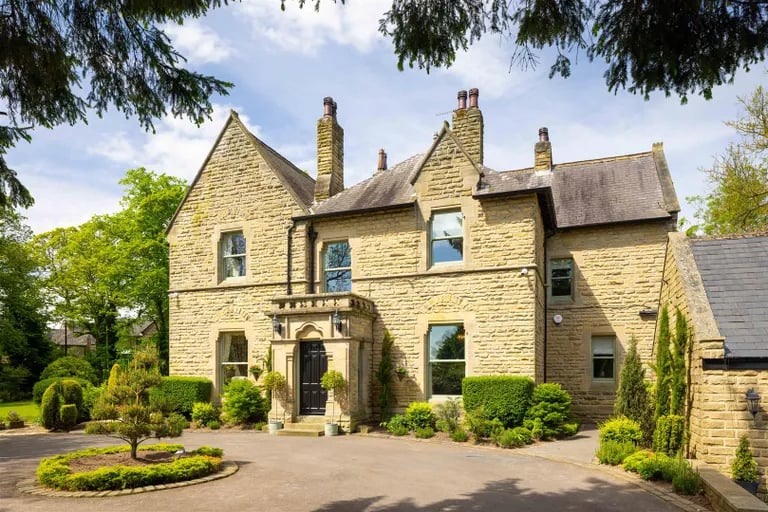 The stunning Old Vicarage with its large in and out driveway to the front.