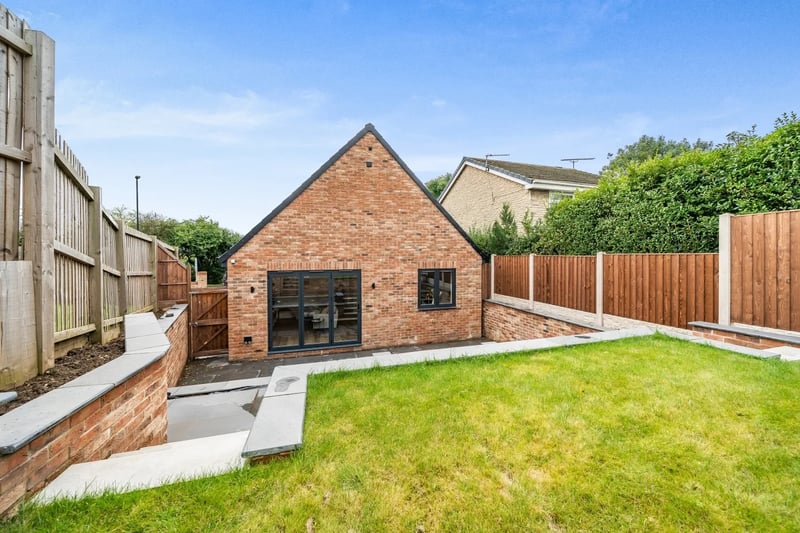 The property benefits from a large flagstone patio at rear of the property, with steps to a second tier patio and third tier lawn. Picture courtesy of Ewemove Sales and Lettings