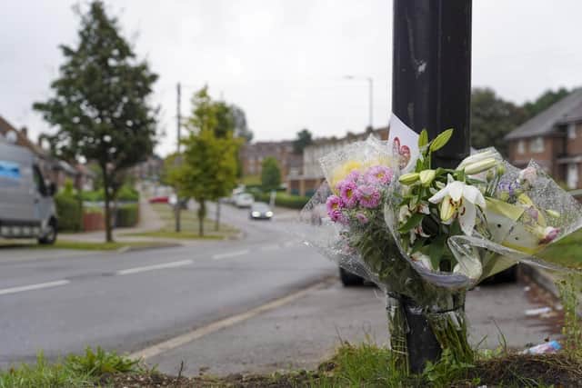 Floral tributes left at the scene of the crash in Harborough Avenue, Manor