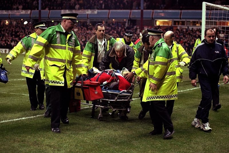 13 Dec 1998:   Injured parachuting Santa is stretchered away after crashing into the Trinity Road Stand during his descent, breaking both his legs and falling 100 feet onto the perimeter track during halftime in the FA Carling Premiership match between Aston Villa and Arsenal at Villa Park in Birmingham, England.  \ Mandatory Credit: Clive Brunskill /Allsport