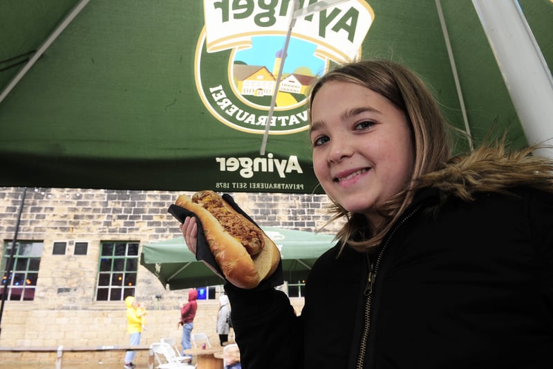Lottie Tyler, 12 of Farsley about to tuck into a bratwurst at the family session.