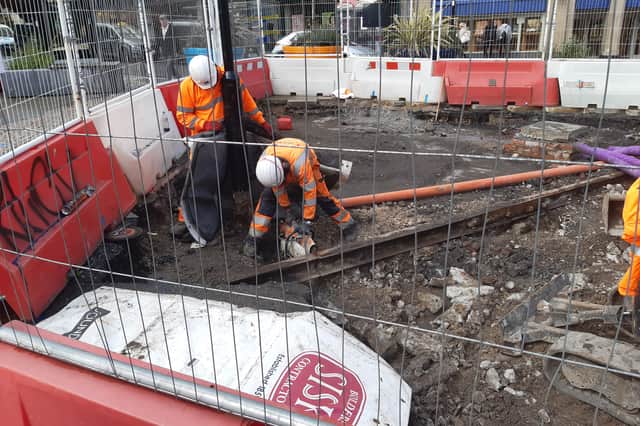 Workmen cutting an old piece of tram track at the top of Fargate, Sheffield. Picture: David Kessen, National World