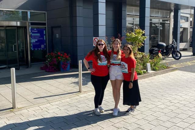 Morgan, Nikky and Kathryn outside the University of Sheffield where they work, in The Brain Tumour Charity's T-shirts