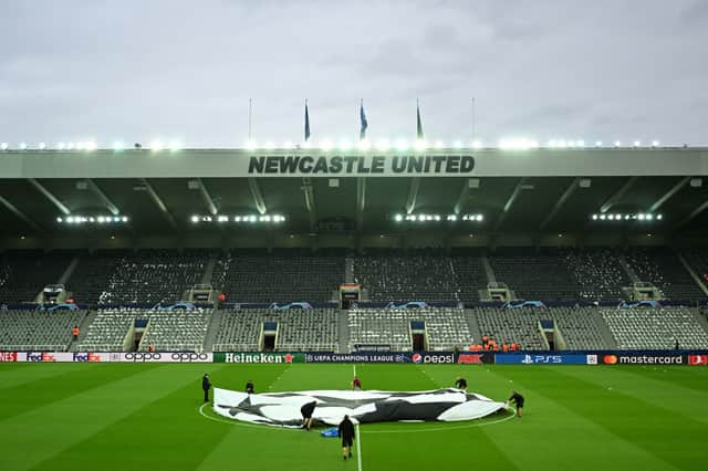 A general view inside the stadium as a UEFA Champions League logo is seen on the pitch prior to the UEFA Champions League match between Newcastle United FC and Paris Saint-Germain at St. James Park on October 04, 2023 in Newcastle upon Tyne, England. (Photo by Michael Regan/Getty Images)