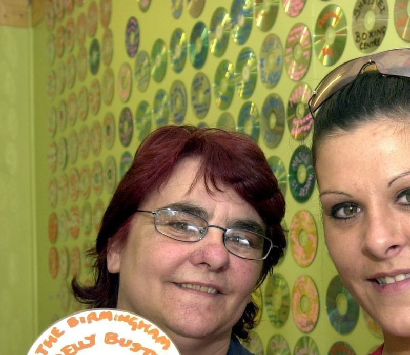 Keeley Brown and her mum Carol with the 'Wonderwall' they created at their family cafe TastyTucker's, in Walkley, Sheffield, in aid of Weston Park Hospital, in May 2003