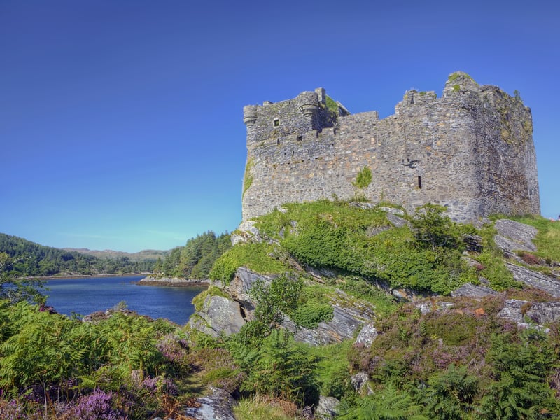 Castle Tioram is a ruin that sits on the tidal island of Eilean Tioram in Loch Moidart in the Scottish Highlands. It dates back to the 14th century but the earliest settlement of the site is linked to the Iron Age. The name in Gaelic “Caisteal Tioram” means “dry castle”.