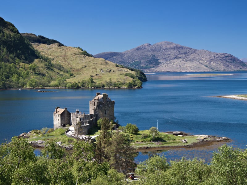 Eilean Donan rests on the meeting point of three sea lochs which are close to the village of Dornie enroute to the Isle of Skye. It was first inhabited in the 6th century and later rebuilt in the mid 13th century. The name means “Island of Donnán” in reference to Donnán of Eigg; a Celtic saint who was martyred in 617.