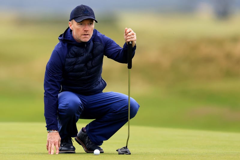 Boyzone singer Ronan Keating lines up a putt on the 17th green of the Old Course.