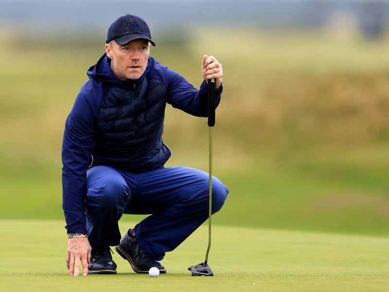 Boyzone singer Ronan Keating lines up a putt on the 17th green of the Old Course.