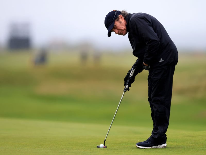 Bon Jovi drummer Tico Torres lines up a putt.