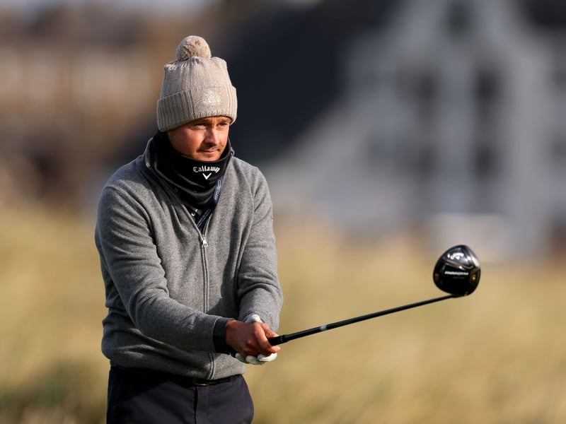 Keane frontman Tom Chaplin keeps a close eye on his drive on the second hole at Carnoustie.