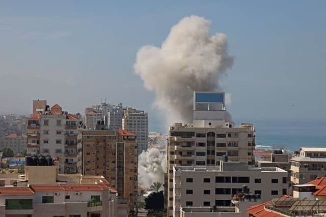 Smoke billows from a residential building following an Israeli airstrike in Gaza City on October 7, 2023. Credit: AFP via Getty Images