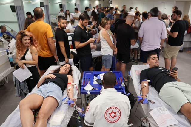 Israelis donate blood at a hospital in Tel Aviv on October 7, 2023. Credit: AFP via Getty Images