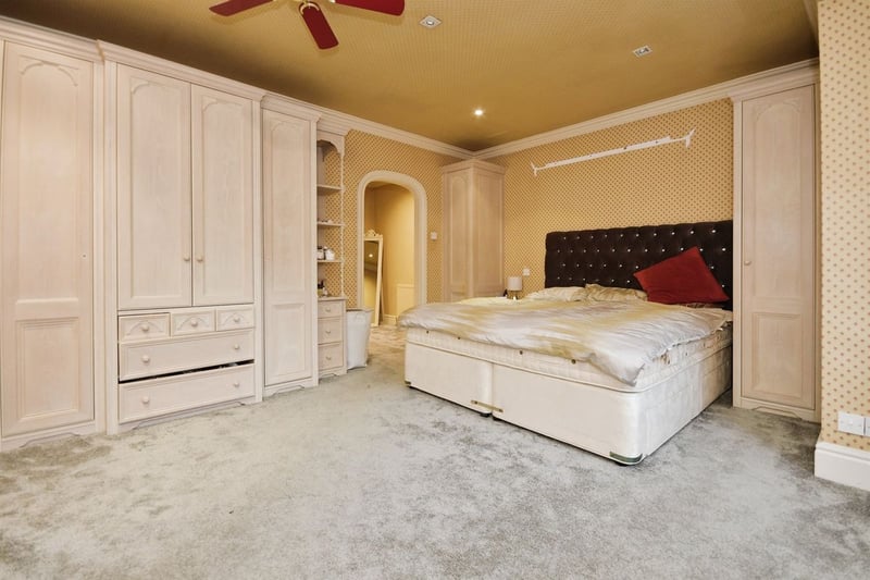 "The largest bedroom, with two front facing, two side facing double glazed windows and rear facing double glazed french doors with Juliet balcony. There are three central heating radiators. This bedroom also benefits from a dressing room/snug."