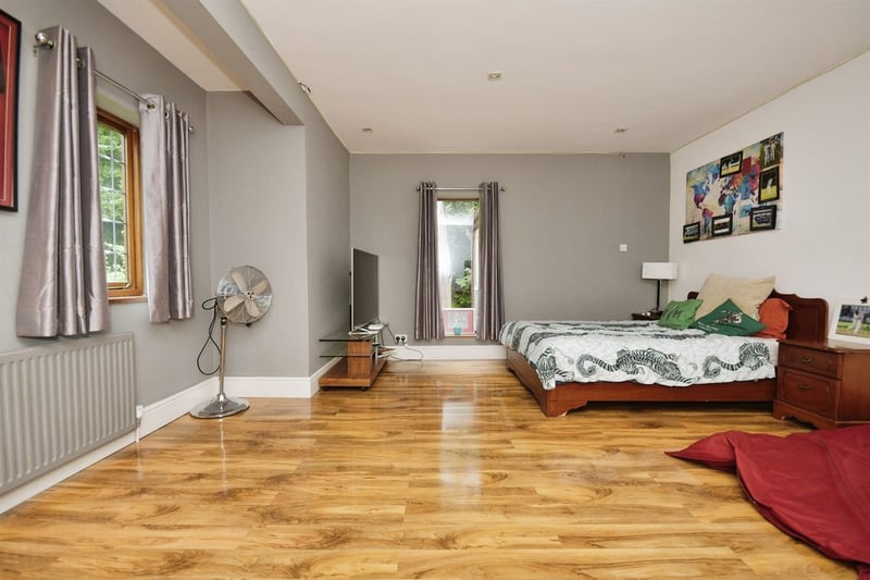 "With two front facing double glazed windows and one side facing double glazed window providing ample natural light. This bedroom has wooden flooring and a built in wardrobe. With central heating radiator."