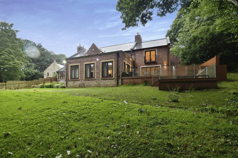 "To the rear of the property there is a ample enclosed lawn with putting green and raised split level enclosed decking perfect for entertaining. There is a tree house and swings and private woodland beyond perfect for any growing family."