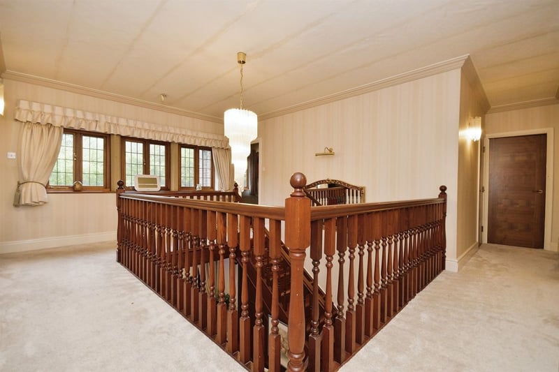 The staircase to the first floor landing is suitably grand. The property is described as have five beds, two bathrooms and "five receptions".