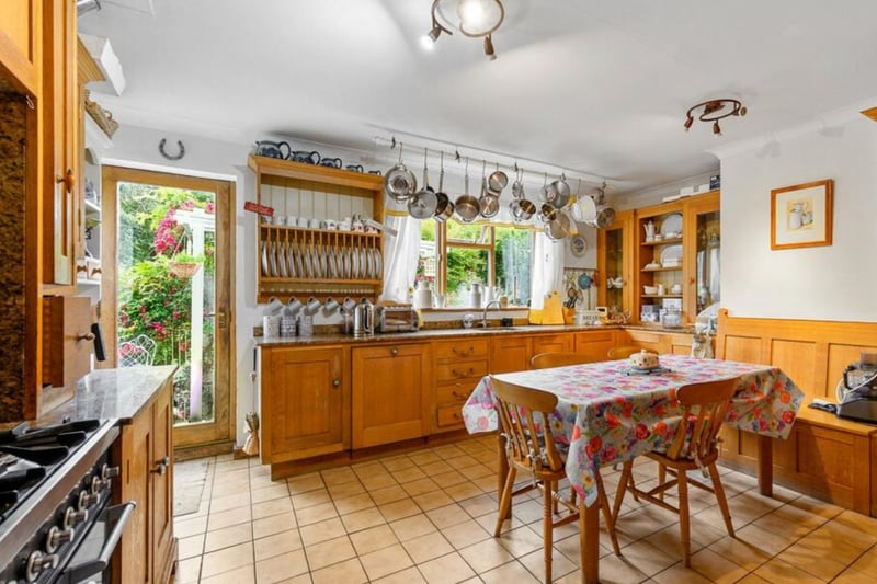 The kitchen features wooden cabinets.