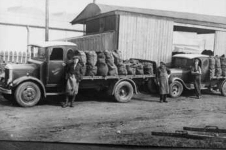 Coal lorries are loaded by drivers for the Kirkintilloch Equitable Co-operative society