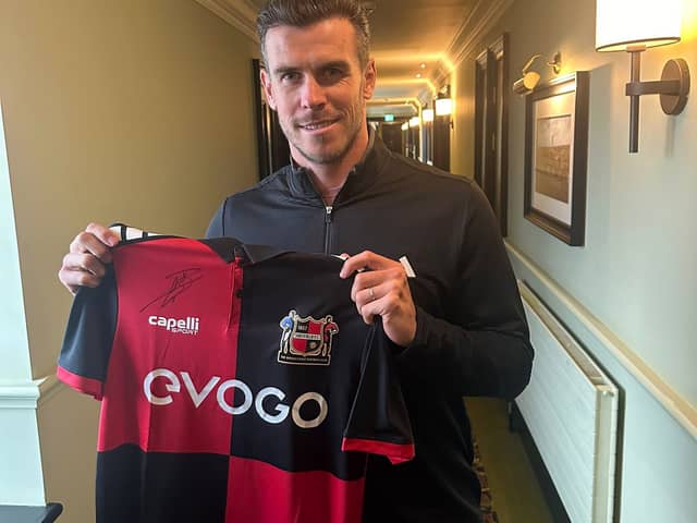 Former Real Madrid star Gareth Bale pictured with a Sheffield FC shirt, after signing it for the club. Picture: Matt Roney, Sheffield FC