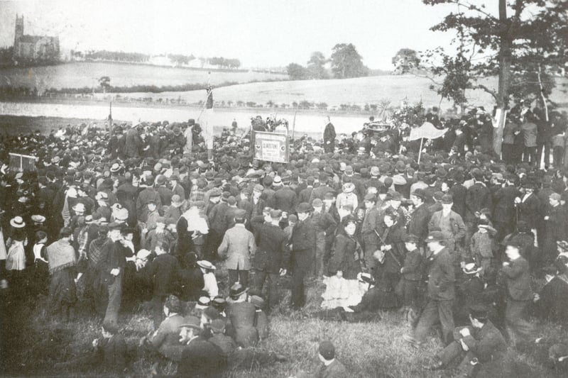 Colonel Hamilton MP addresses the crowds in Wishaw. Cambusnethan Old Parish Church on Greenhead Road is visible in the background. Judging by the position of the photograph, this gathering was in Houldsworth Public Park, where St. Ignatius and Wishaw Academy primary schools are located now. The reform demonstrations were one of the first major movements driven by the working class when they began in the early 19th century - the working class were demanding the same right to vote as property owners and the higher classes of Britain.