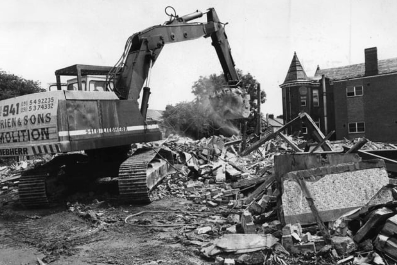 A digger clears another load of bricks and mortar away from the Ingham Infirmary which was to make way for housing. Photo: Shields Gazette