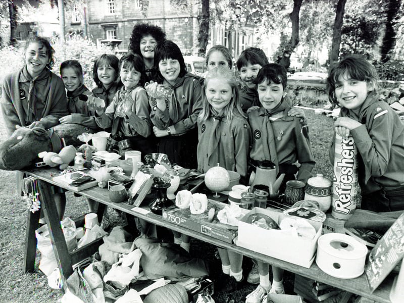 Many youngsters were involved in the Guides or the cubs. Guides are picture with their bric-a-brac stall at the Broomhill Festival in Sheffield on June 18, 1988