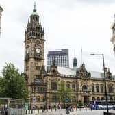 A protester climbed onto the roof of Sheffield town hall to remove an Israeli flag