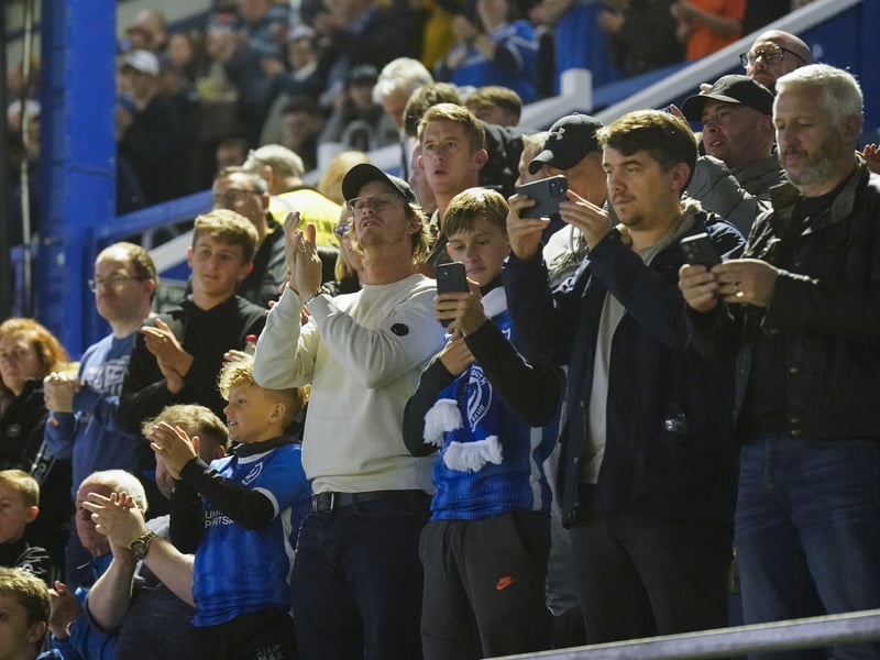 Pompey fans photograph and clap their heroes.