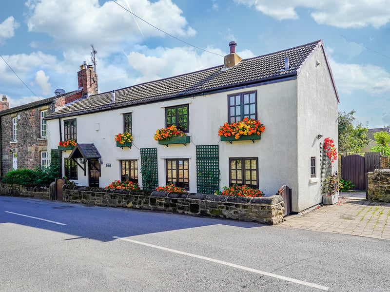 This four bedroom cottage in South Yorkshire was once the village post office. (Photo courtesy of Redbrik)
