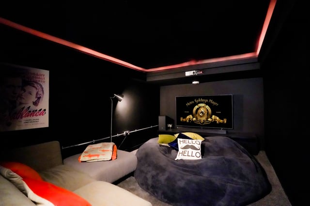 A dark cinema room provides an excellent space to enjoy your favourite films. (Photo courtesy of Redbrik)