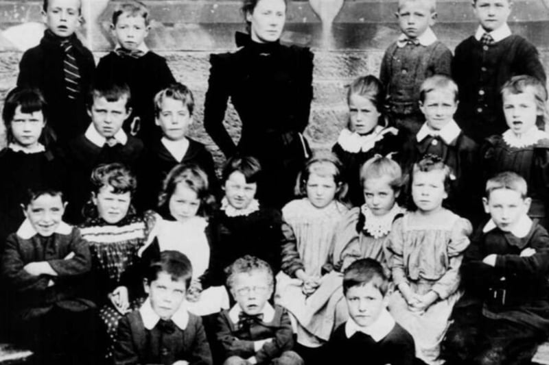 A class photo at Bishopbriggs School at the turn of the century - we wouldn’t have wanted to get  the bad side of this teacher.