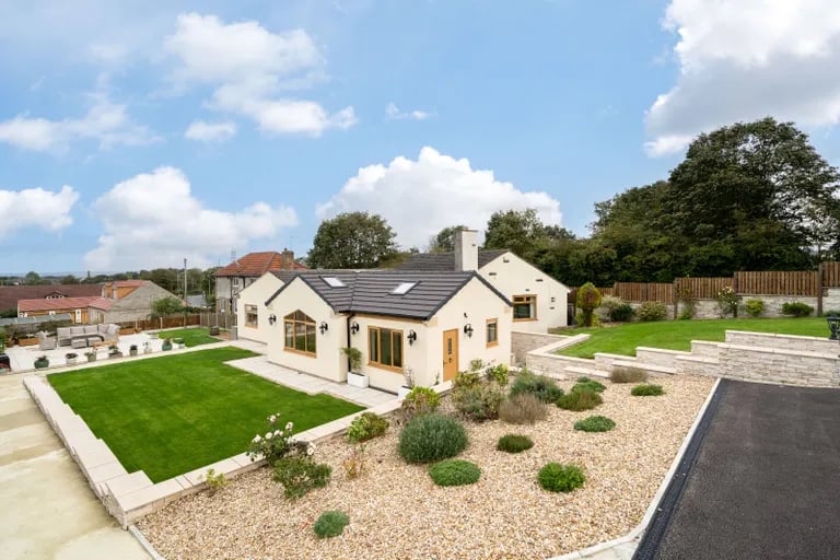 This magnificent five bedroom bungalow with large gardens is for sale.