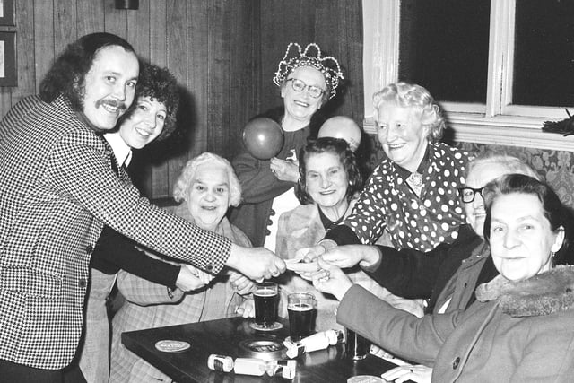 Pallion Inn manager Paddy McGuigan and his wife, Margaret, with senior citizens at Christmas 1974.
The money for the festive treat was raised by the Darts Club, the Jolly Girls concert party, and customer donations.