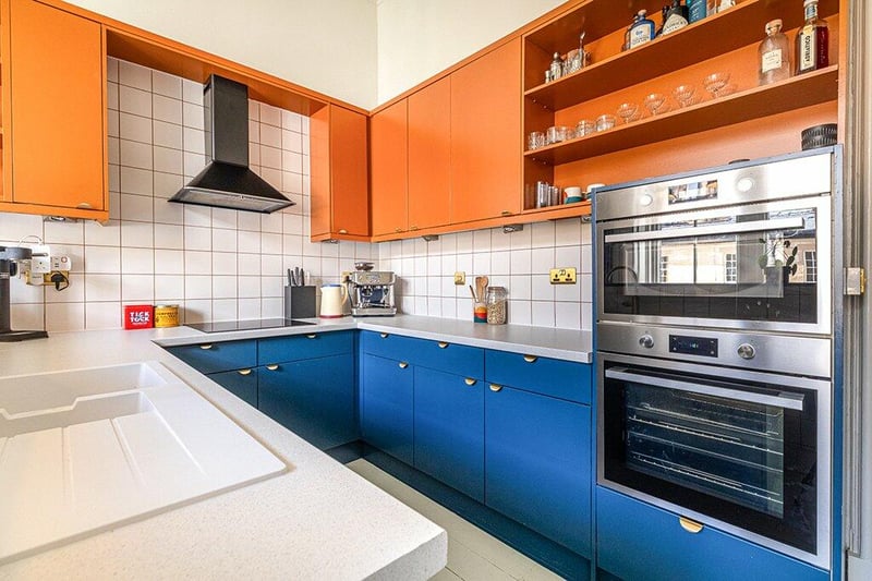 The kitchen is complete with a range of updated base and wall units, refitted worktops, tiled backsplash and integrated oven, microwave, induction hob, extractor hood.