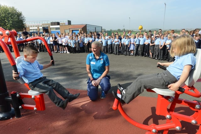 England Women Rugby World Cup winner Tamara Taylor watches as Sam Lawson (left) and Daisy Gray try out the new playground gym equipment at Seaburn Dene Primary School, in 2014.