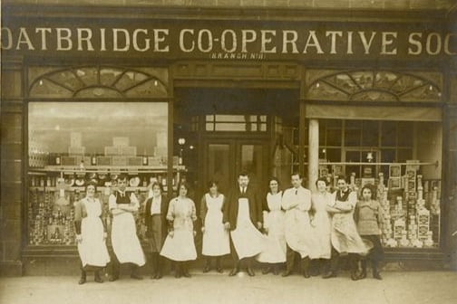 Employees of Coatbridge Co-operative Society shop Branch No 11 (Muiryhall Street) standing in front of the shop.