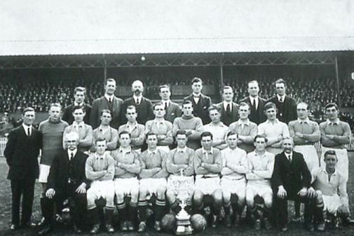 Photograph of the cup winning team , there was a massive attends, just take a look at the crowds in the background.