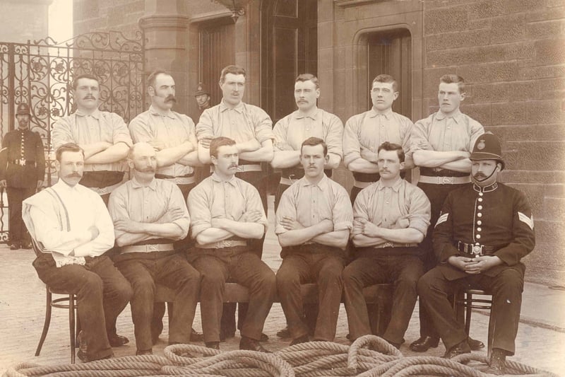The Police Tug o’ War team (note the forearms on these fellas) are pictured with their rope in the courtyard of the Coatbridge Municipal Buildings, which housed the Burgh Police Station.