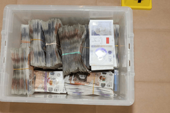 £97,064 in cash was found around the property, as well as a cash-counting machine.
