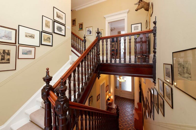 The house is spread across four levels with this stairway leading to the first floor. 