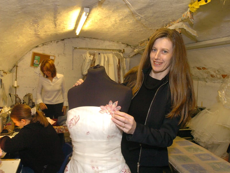 Debbie Moorhouse, dress designer and shop owner at Daniella Lara bridal shop, on Church Street, Ecclesfield, Sheffield, pictured at work in the workroom in 2004